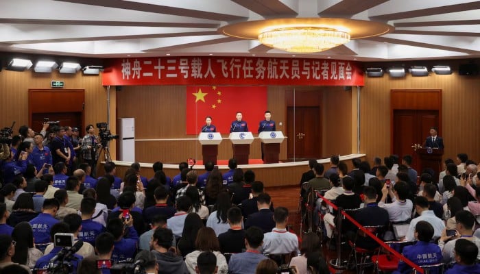 Astronauts Zhu Yangzhu, Zhang Zhiyuan, and Lai Ka-ying, who is the first astronaut from Hong Kong, attend a press conference before the Shenzhou-23 spaceflight mission to Chinas Tiangong space station, at Jiuquan Satellite Launch Centre, near Jiuquan, Gansu province, China, May 23, 2026. — Reuters