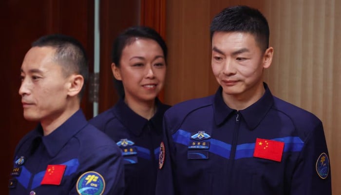 Astronauts Zhu Yangzhu, Zhang Zhiyuan, and Lai Ka-ying, who is the first astronaut from Hong Kong, walk to attend a press conference before the Shenzhou-23 spaceflight mission to Chinas Tiangong space station, at Jiuquan Satellite Launch Centre, near Jiuquan, Gansu province, China, May 23, 2026.  — Reuters