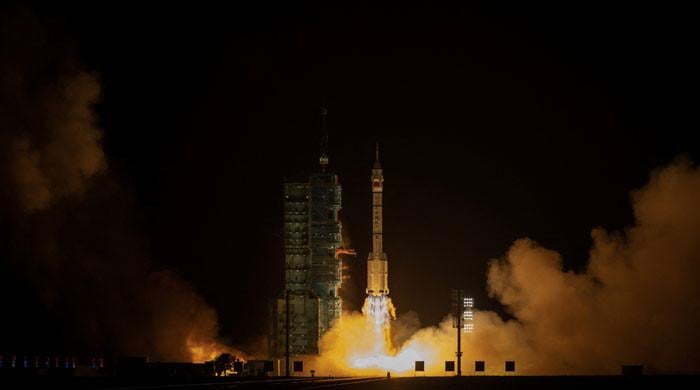 China launches three-crew space flight as part of Moon ambitions