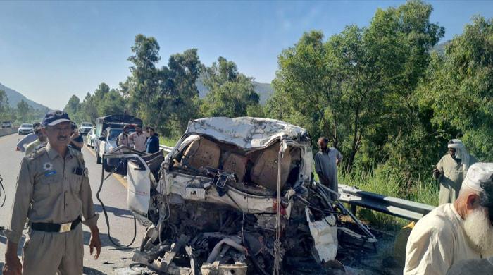 At least 18 killed as passenger coach hits parked bus on Swat Motorway