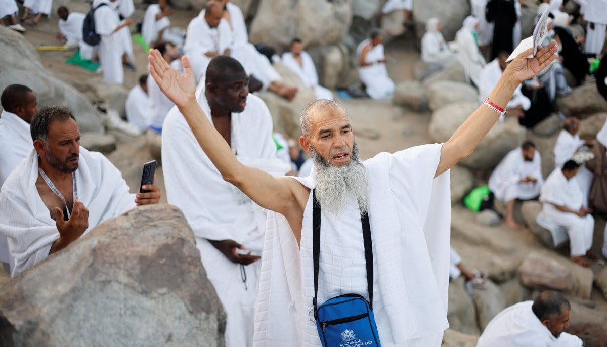 A Muslim pilgrim gestures at Mount of Mercy on the plain of Arafat as the sun rises during the annual Hajj pilgrimage, outside the holy city of Makkah, Saudi Arabia, May 26, 2026. — Reuters