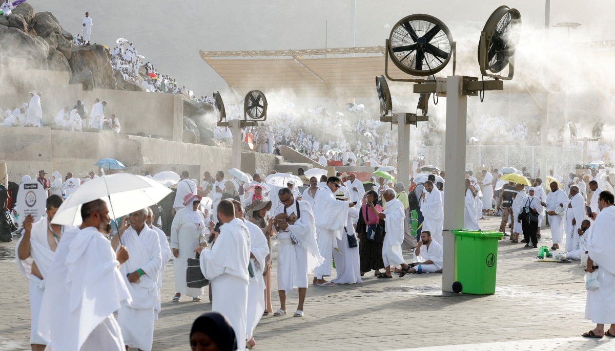 Muslim pilgrims gather near misting fans at Mount of Mercy on the plain of Arafat during the annual Hajj pilgrimage, outside the holy city of Mecca, Saudi Arabia, May 26, 2026. — Reuters