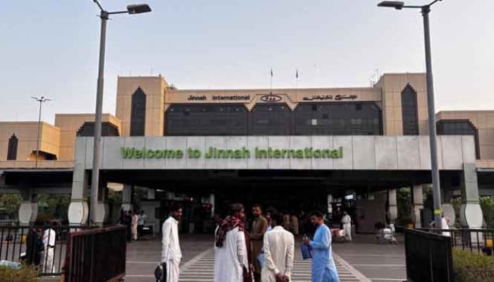 Passengers wait outside at Jinnah International Airport after all domestic and international flights were cancelled in Karachi, Pakistan, May 7, 2025. — AFP
