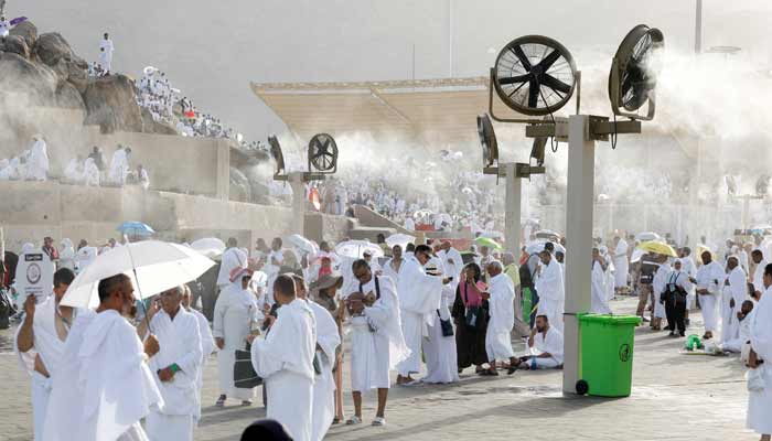 Muslim pilgrims gather near misting fans at Mount of Mercy on the plain of Arafat during the annual Hajj pilgrimage, outside the holy city of Makkah, Saudi Arabia, May 26, 2026.— Reuters