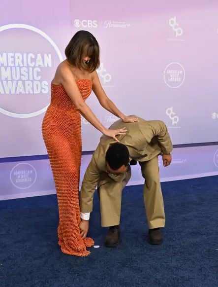 John Legend steps in as Chrissy Teigen suffers wardrobe malfunction at AMAs