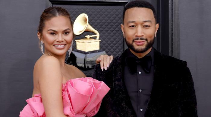 John Legend steps in as Chrissy Teigen suffers wardrobe malfunction at AMAs