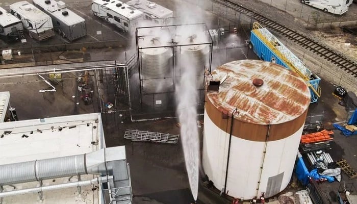 A drone picture shows water being sprayed on a tank as a chemical incident involving a failing tank of flammable liquid called methyl methacrylate, used in the aerospace industry, has forced an evacuation in the surrounding area in Garden Grove, California, US May, 22, 2026.— Reuters