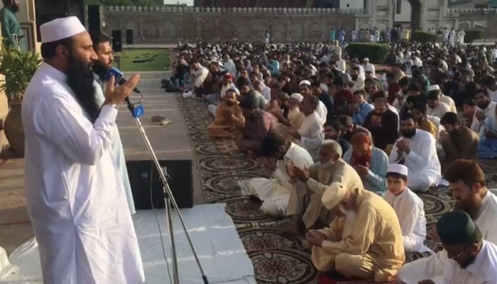 Worshippers offer prayers after Eid ul Adha prayers in Lahore on May 27, 2026. — Geo News