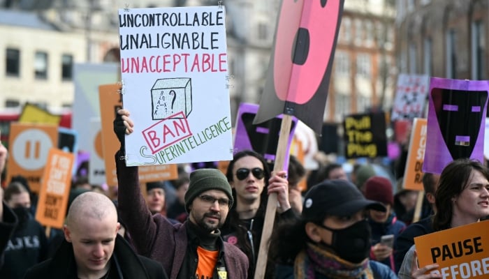Protesters gather with banners and placards at a protest organised by PauseAI UK and other groups concerned in controlling the development of advanced Artificial Intelligence systems, in London on February 28, 2026. — AFP