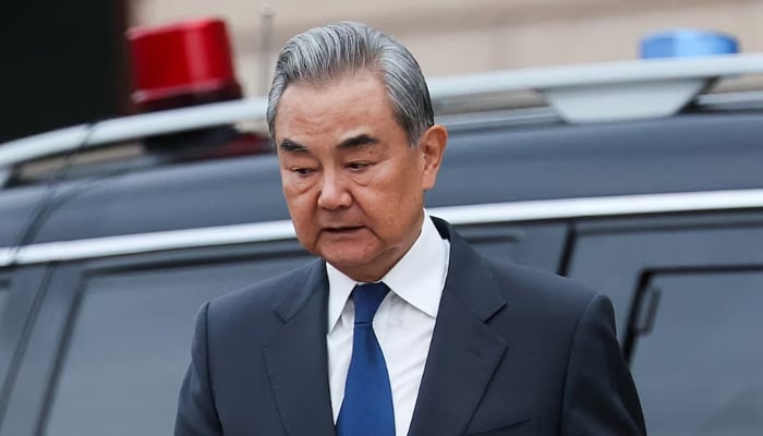 Chinese Foreign Minister Wang Yi leaves the Great Hall of the People in Beijing during Russian President Vladimir Putin visit to China, May 20, 2026. — Reuters