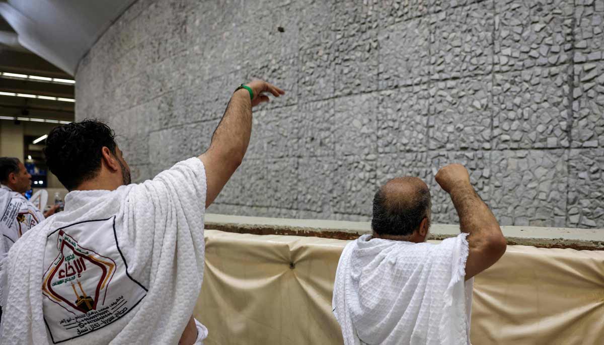 Muslim pilgrims perform the symbolic stoning of the devil ritual as part of the Hajj pilgrimage in Mina on May 27, 2026. — AFP