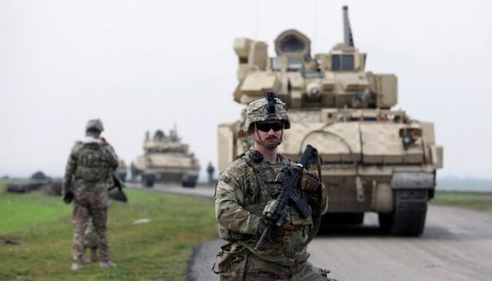 A soldier from the US-led coalition stands guard in the countryside of Qamishli in northeastern Syria February 8, 2024. — Reuters