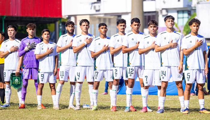 Pakistan players sing their national anthem ahead of their SAFF U20 Championship match against India at the National Football Stadium in Male, Maldives, on March 26, 2026. — SAFF