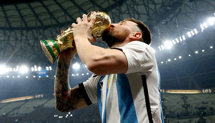 Argentinas Lionel Messi kisses the trophy as he celebrates winning the World Cup, Fifa World Cup Qatar 2022 - Final - Argentina v France - Lusail Stadium, Lusail, Qatar - December 18, 2022. — Reuters