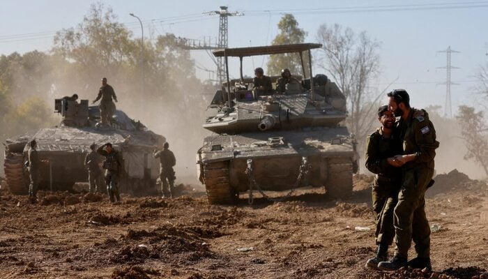 Israeli soldiers embrace after returning from the Gaza strip, amid the ongoing conflict between Israel and Palestinian group Hamas, in southern Israel, February 29, 2024. — Reuters