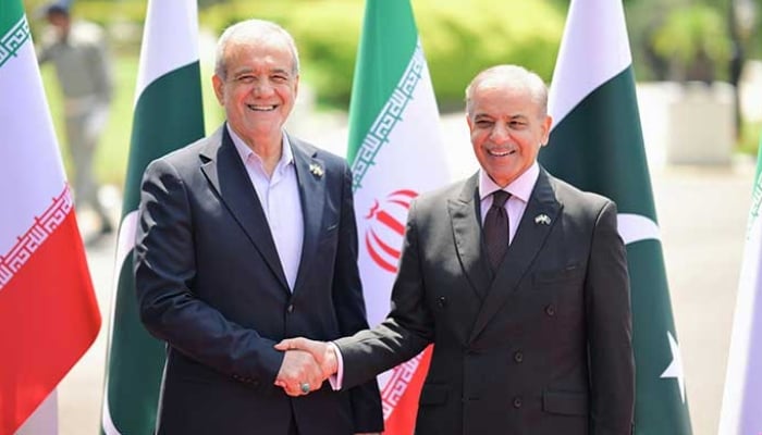 Prime Minister Shehbaz Sharif (right) receives Iranian President Dr Masoud Pezeshkian at the Prime Ministers House, Islamabad, on August 3, 2025. — X/@GovtofPakistan