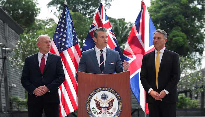 Australian Defence Minister Richard Marles and British Defence Secretary John Healey look on as US Secretary of Defense Pete Hegseth speaks during an AUKUS Defence ministers press huddle at the US Embassy in Singapore, May 30, 2026.— Reuters