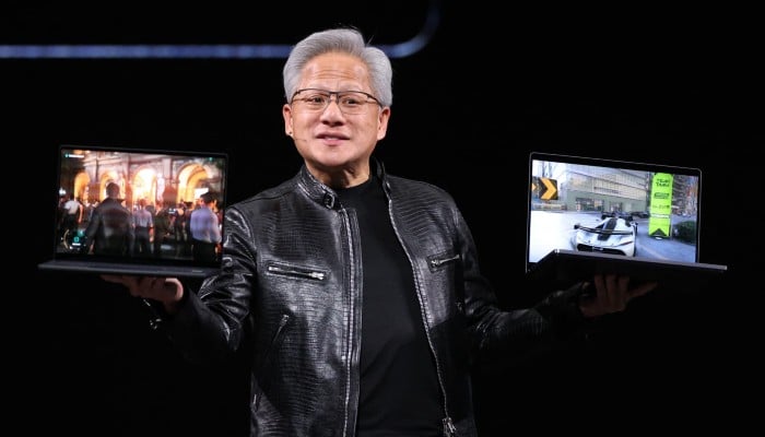 Nvidia CEO Jensen Huang introduces the RTX Spark laptop during his keynote speech at Computex 2026 in Taipei on June 1, 2026. — AFP