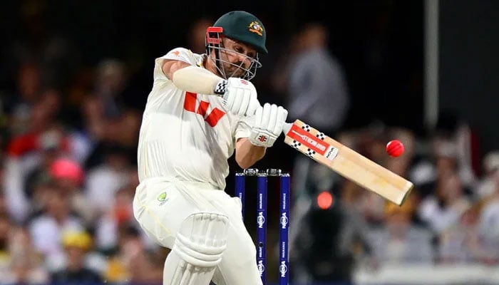 Australias Travis Head plays a shot during the fourth day of their second Ashes Test against England at the Brisbane Cricket Ground in Brisbane on December 7, 2025. — Cricket Australia