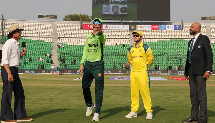 Pakistan captain Shaheen Shah Afridi (left) flips the coin as Australias Josh Inglis makes the call at the toss for their second ODI at the Gaddafi Stadium in Lahore on June 2, 2026. — PCB