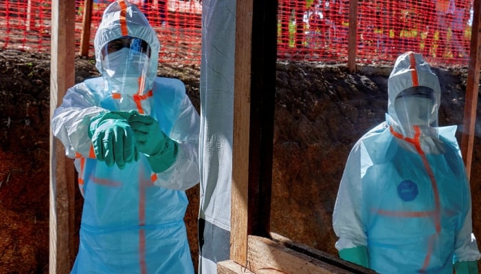 Health workers get dressed in personal protective equipment (PPE) at the Evangelical Medical Center in Bunia, Ituri province, Democratic Republic of Congo, May 31, 2026. — Reuters