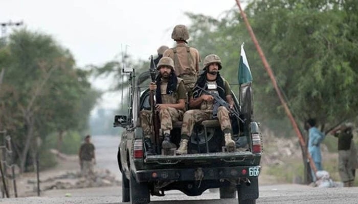 Pakistan Army personnel travelling on a military vehicle. — AFP/ File