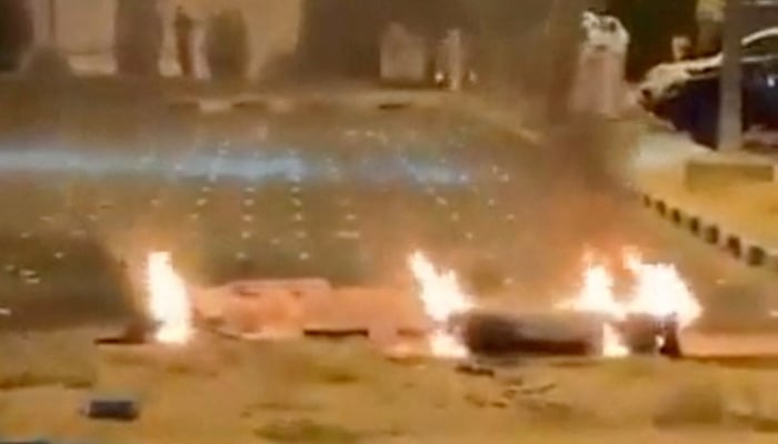 Debris burns on the ground in a parking lot following reports of missile and drone attacks, in Sabah Al Nasser, Kuwait June 3, 2026, in this screengrab obtained from a social media video. — Reuters