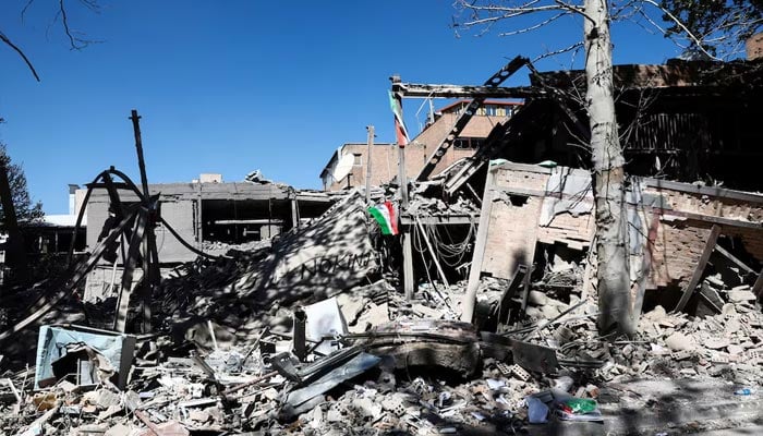 An Iranian flag lies amidst the rubble of a building of the Sharif University of Technology, which was damaged in a strike, amid the US-Israeli conflict with Iran, in Tehran, Iran, April 7, 2026. — Reuters