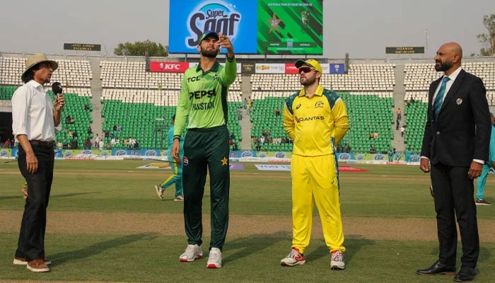Pakistan captain Shaheen Shah Afridi (centre) flips the coin as Australias Josh Inglis (second from right) makes the call at the toss for their second ODI at the Gaddafi Stadium in Lahore on June 2, 2026. — PCB
