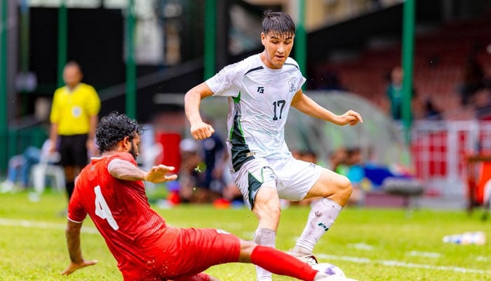 Pakistans Ali Agha (right) vies for balls possession during their Diamond Jubilee International Football Tournament match against Maldives at the National Football Stadium in Male on June 4, 2026. — Football Association of Maldives