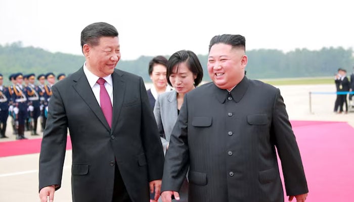 North Korean leader Kim Jong Un welcomes Chinese President Xi Jinping at the Pyongyang International Airport in Pyongyang, North Korea, in this undated photo. — Reuters/File