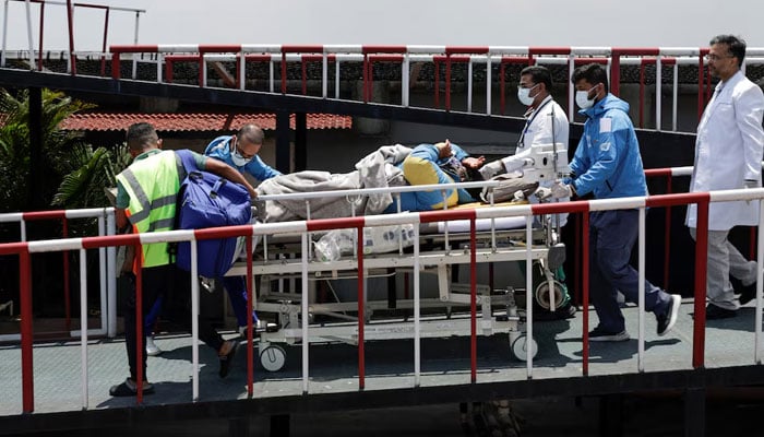 Paramedics transport Dawa Sherpa, who was missing for several days in the Everest region, from the helipad at HAMS Hospital in Kathmandu, Nepal, June 4, 2026.— Reuters/File