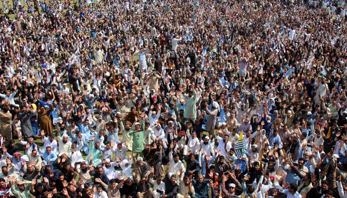 Supporters of the Joint Awami Action Committee (JAAC) chant slogans following a shutter-down strike in Muzaffarabad on October 2, 2025. — Reuters
