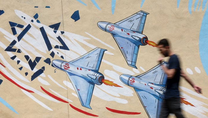 An Iranian man walks next to an anti-Israeli mural on a street in Tehran, Iran June 6, 2026.— Reuters/File