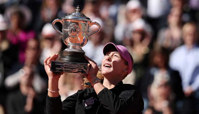 Russias Mirra Andreeva celebrates with the trophy after winning her final match against Polands Maja Chwalinska at Roland Garros, Paris, France on June 6, 2026. — Reuters