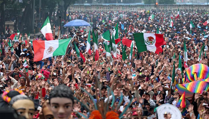 People participate in an attempt to break the Guinness World Record for the worlds largest Mexican wave along Reforma Avenue as part of activities ahead of the Fifa World Cup 2026, in Mexico City, Mexico, June 6, 2026. — Reuters