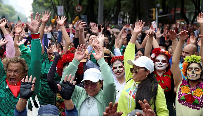 People participate in an attempt to break the Guinness World Record for the worlds largest Mexican wave along Reforma Avenue as part of activities ahead of the Fifa World Cup 2026, in Mexico City, Mexico, June 6, 2026. — Reuters