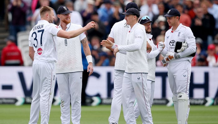 Englands Gus Atkinson celebrates with teammates after taking the wicket of New Zealands Matt Henry to complete his five wickets haul during First Test against New Zealand Lords Cricket Ground, London, Britain on June 7, 2026. — Reuters