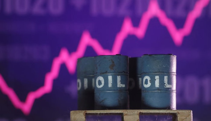 Rising stock graph and 3D printed oil barrels miniature are seen in this illustration taken June 23, 2025. — Reuters