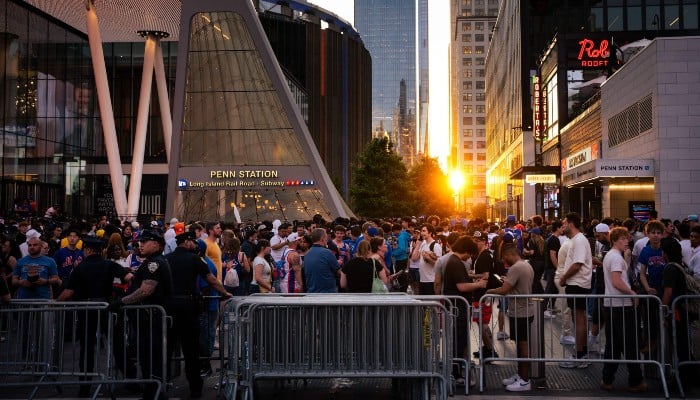 New York Knicks fans arrive outside Penn Station and Madison Square Garden before Game 2 of the NBA Finals against the San Antonio Spurs on June 05, 2026, in New York City. — AFP
