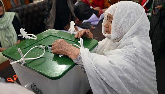 An elderly woman casts her vote at a polling station during the Gilgit-Baltistan General Elections, June 8, 2026. — APP