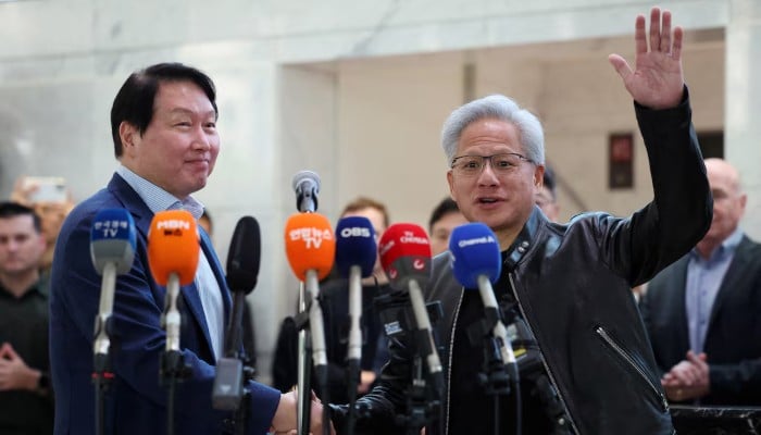Nvidia CEO Jensen Huang shakes hands with SK Group Chairman Chey Tae-won after a media briefing following their meeting at SK group’s office building in Seoul, South Korea, June 8, 2026. — Reuters