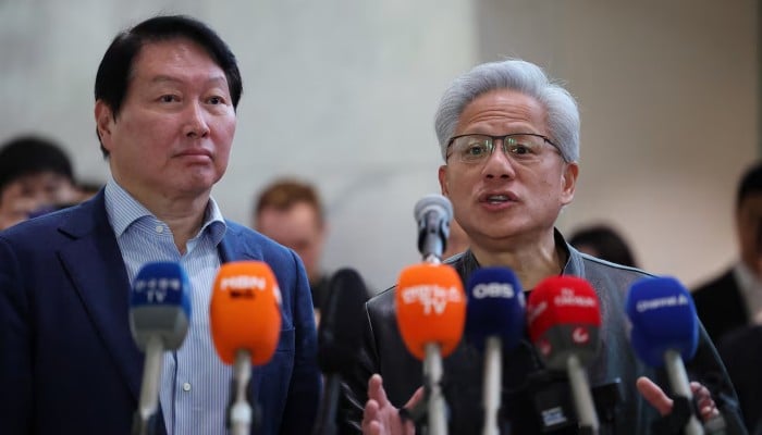 Nvidia CEO Jensen Huang answers a reporters question during a media briefing after a meeting with SK Group Chairman Chey Tae-won at SK groups office building in Seoul, South Korea, June 8, 2026. — Reuters