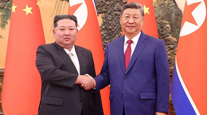 China's Xi lands in North Korea for rare visit