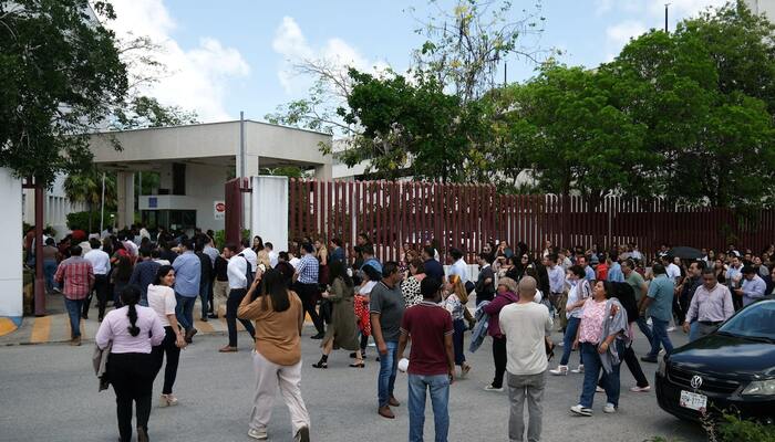 Employees return to the Federal Judiciary building following an evacuation after a 6.1-magnitude earthquake struck off the coast of Cuba and was felt in the Mexican resort cities of Cancun, Playa del Carmen and Tulum, in Cancun, Mexico, June 8, 2026. — Reuters