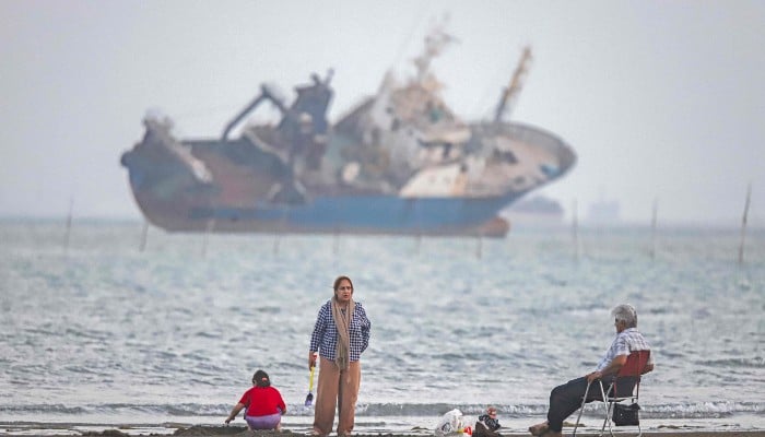 In this picture obtained from Irans ISNA news agency on June 1, 2026, Iranians sit on Suru Beach in Bandar Abbas along the Strait of Hormuz. — AFP