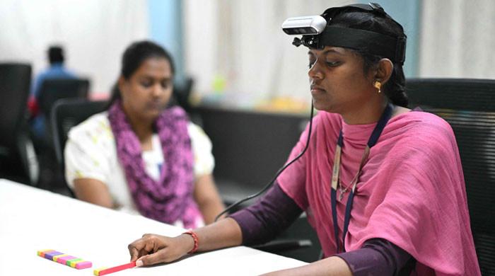 The Indian workers training AI robots to take their jobs