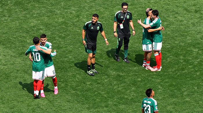 Mexico get World Cup party started with 2-0 win over nine-man South Africa