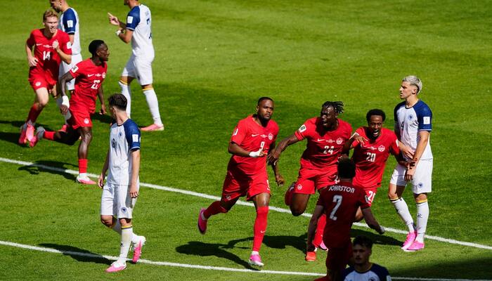 Canadas Cyle Larin celebrates scoring their first goal with teammates as Bosnia and Herzegovinas Tarik Muharemovic looks dejected at FIFA World Cup 2026 Group B, Canada v Bosnia and Herzegovina game in Toronto Stadium, Toronto, Canada on June 12, 2026. — Reuters/File