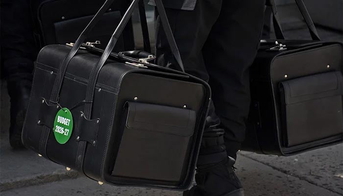 Police commandos from Federal Board of Revenue (FBR) shift boxes with copies of the 2026–27 fiscal budget outside the Parliament House in the Federal Capital, before the start of the budget session, in Islamabad, on June 12, 2026. — Online